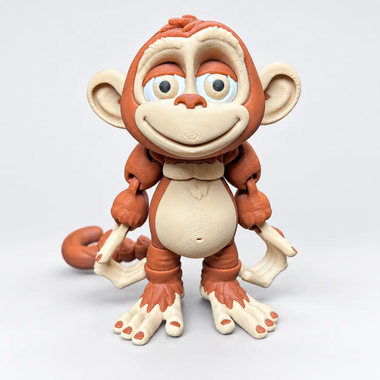 3D Printed Articulated Monkey Figure with Expressive Eyes and Movable Joints for Desk Display and Collection