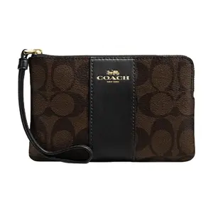 COACH Corner Zip 16 Handbag for Women – Monogram Canvas and Leather Wristlet, Mahjong-Style Coin Purse, Dark Brown