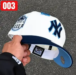 9FORTY New York Yankees 1999 World Series Side Patch Cap – Cream & Black Adjustable Hat with Red NY Logo