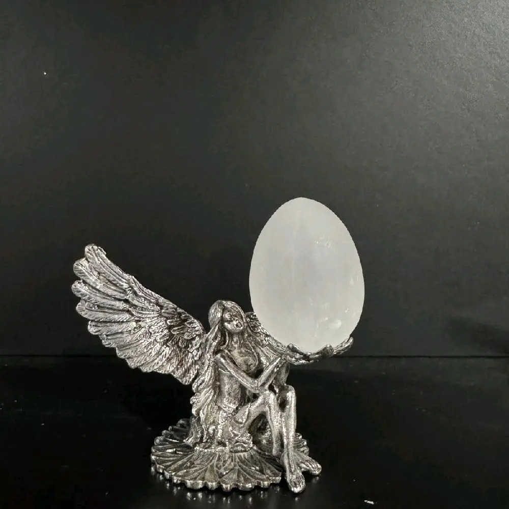 Selenite egg with fairy base Selenite egg with fairy base