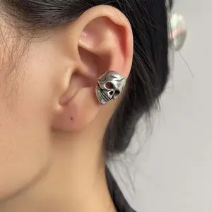 Mini silver hollow skull ear clips for couples without pierced ears