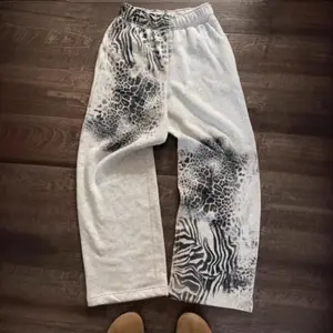 European and American autumn and winter fashion personalized printed casual versatile pants, elastic casual long sweatpants