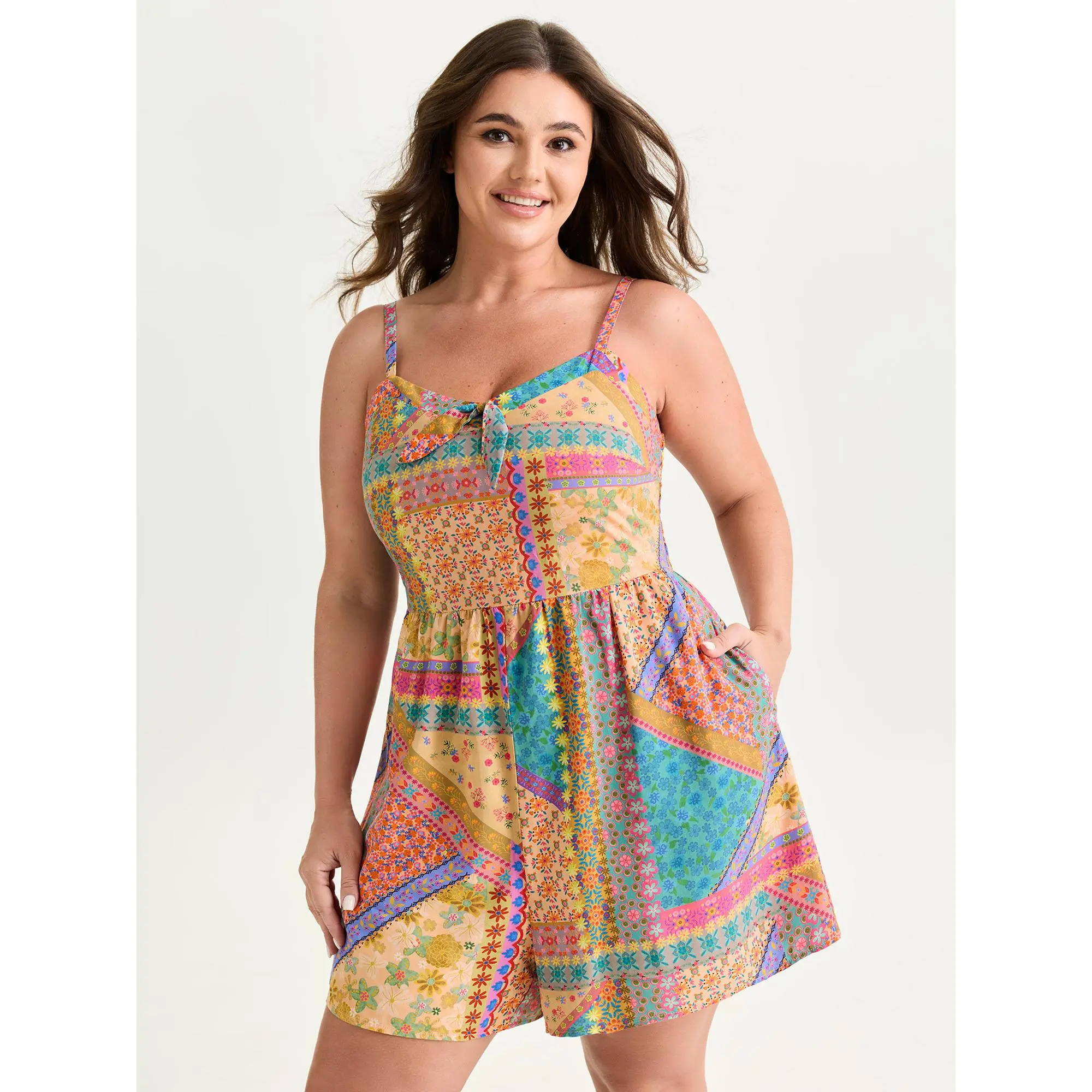 BloomChic Women's Plus Size Bohemian Multicolor Floral Patchwork Rayon Romper with Smocked Bodice, Bowknot & Pockets, Smooth, Polyester, Garment, Casual Wear, Fabric, Plus Size Clothes, Playful, Low Iron, Sleeveless