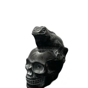 Black obsidian crystal skull with lizard on top , weighs 473g