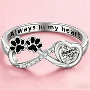 A stylish and exquisite diamond-encrusted puppy paw print ring with a heart-shaped cat paw design, a perfect keepsake ring.