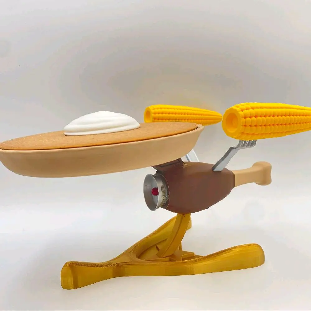 3D Printed Starship Enterprise Model with Detailed Features and Vibrant Yellow Accents