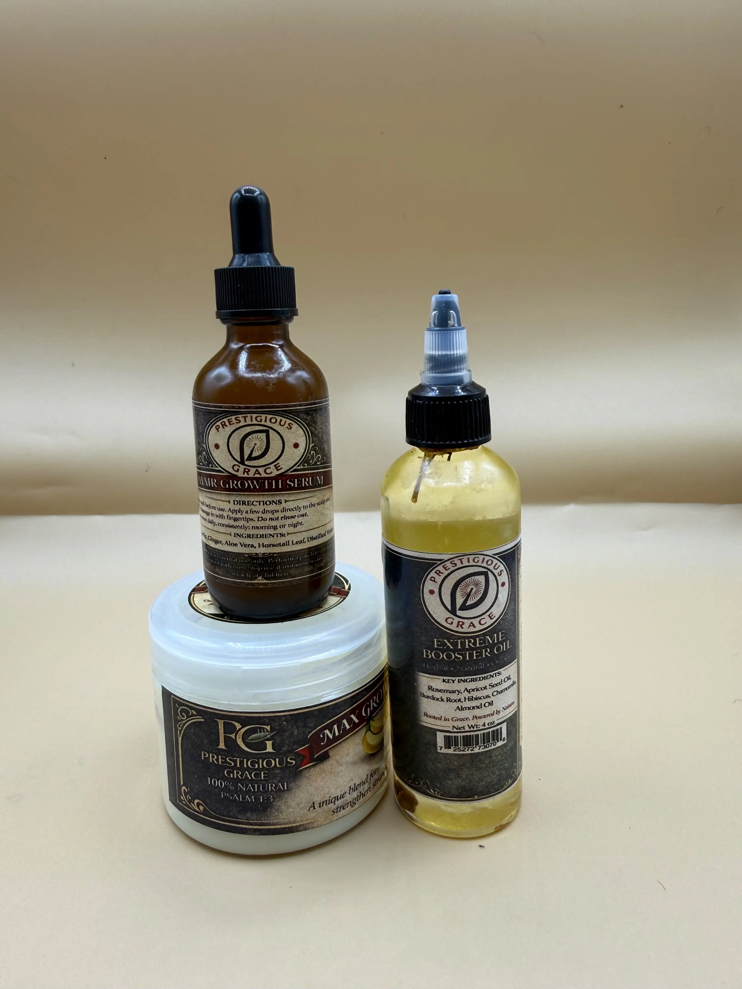 Prestigious Grace Hair Care Trio includes Hair Growth Serum, Pomade, and Extreme Booster Oil.