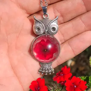 Real preserved flower necklace pendant and chain.