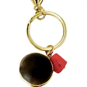 Protección al Maximo Metal Coating - Keychain with Black Sphere and Red Element, Gold Finish, Includes Loop Attachment