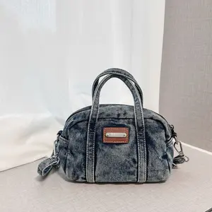New denim hand-held Boston  with simple and stylish daily texture, bowling , single shoulder crossbody  curve tote Vintage Gold-Plated Lock Multi-Pocket Bag