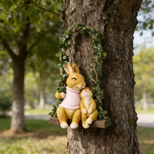 A Decorative Statue of a Mother Rabbit And Her on a Swing, a Hanging Ornament for Outdoor Doors, Garden Decor, Yard Decorations, Lawn Ornaments, And Holiday Gifts, Easter Decor and Gift, Mother's Day Gift