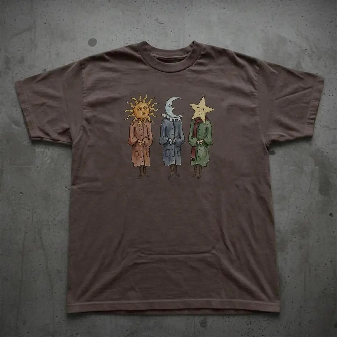 Celestial Sun Moon Star Graphic T-Shirt | Whimsical Anthropomorphic Cosmic Trio Print Tee | Dark Academia Aesthetic Crewneck | Soft Brown Cotton Short Sleeve Streetwear