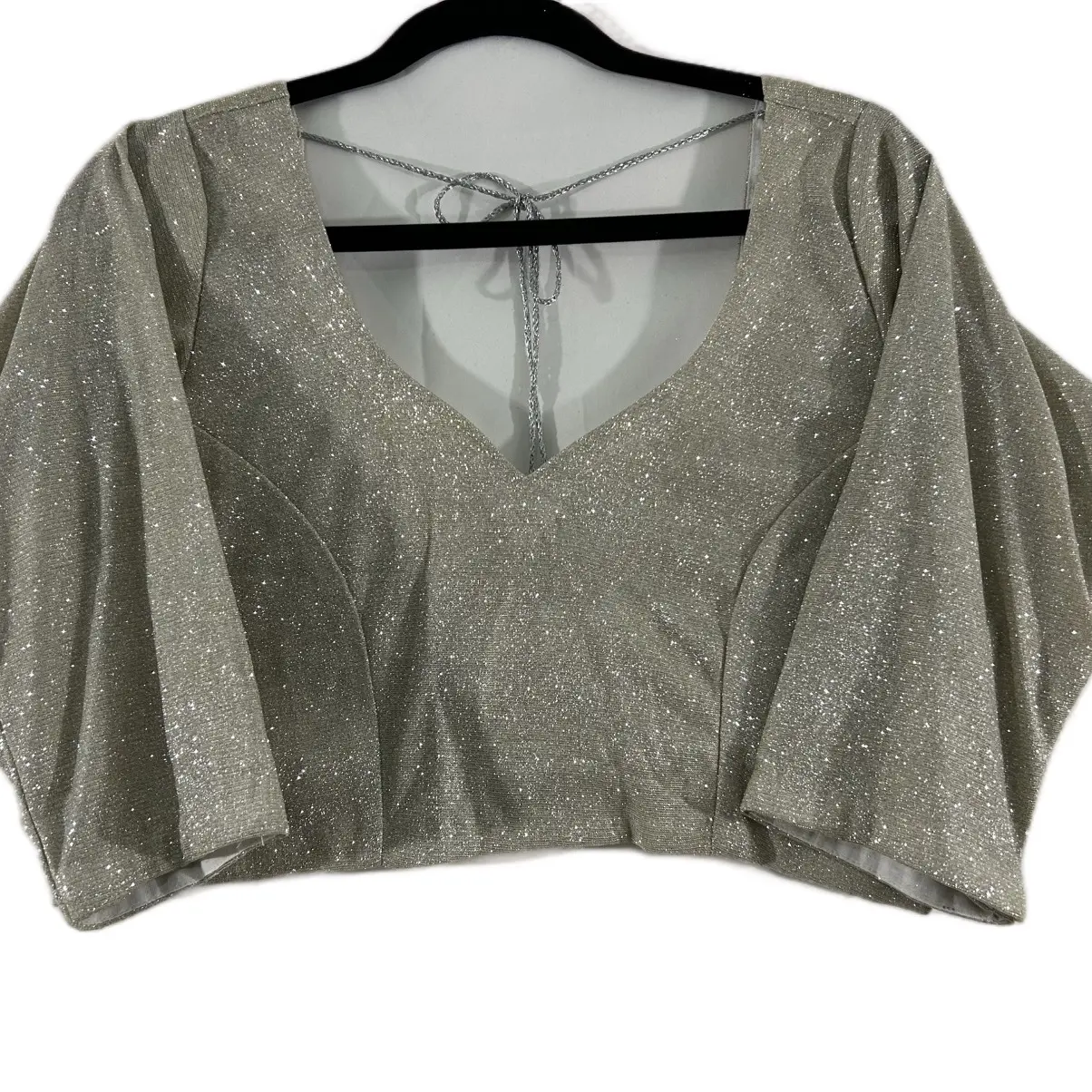 Trendy Women's Silver Shimmer Fitted Blouse with Stylized Deep Boat Back and Layered Tassel Dori Design, Matches a variety of Saree and Lehnga Choices.