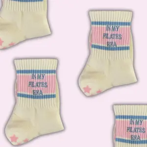 In my Pilates era retro cream non slip grip sock with pink and blue stripes and pink heart grips