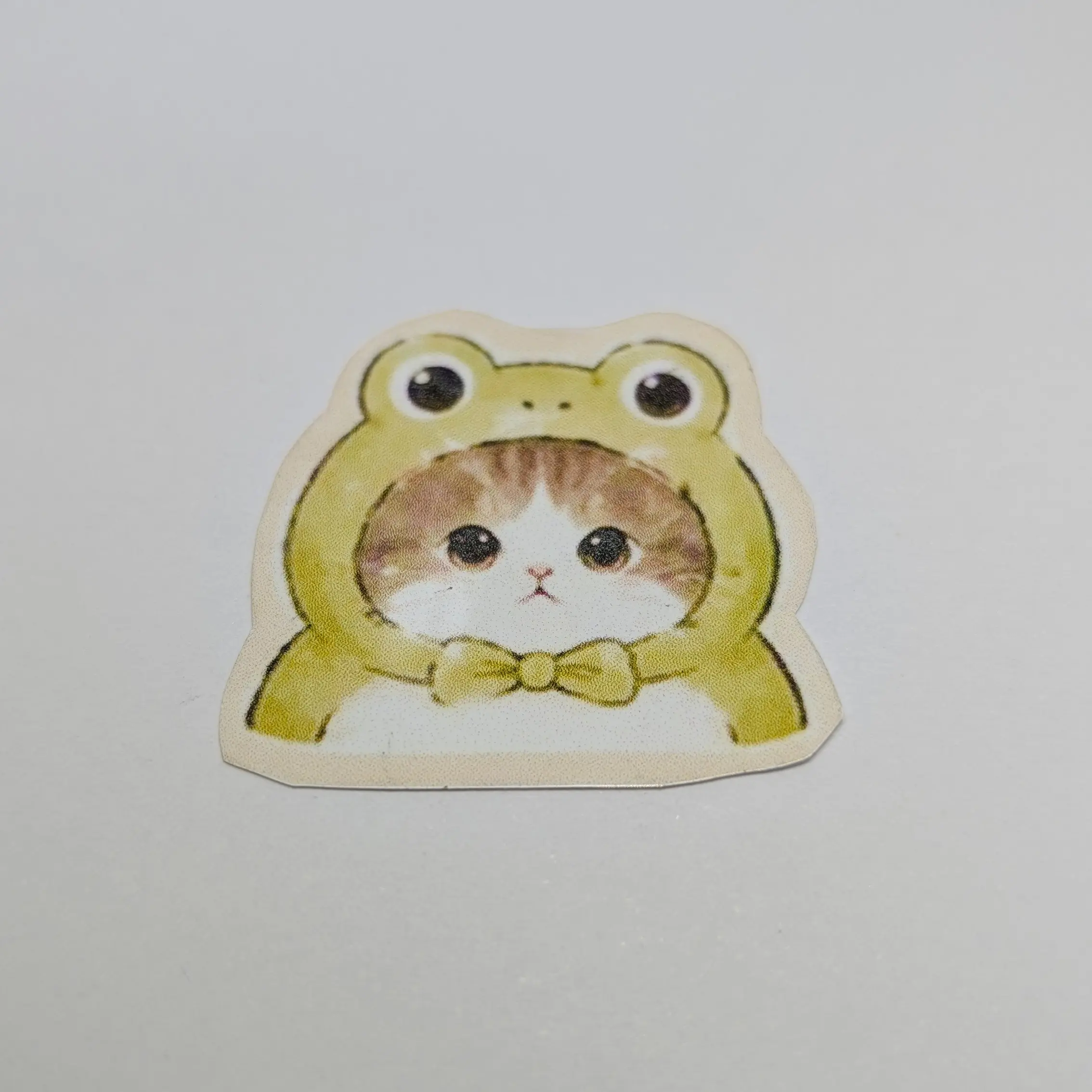 Cute Cat in Frog Costume Sticker - Adorable Animal Design for Kids and Adults - Perfect for Gifts and Decorations