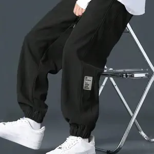 Men's Solid-colored Corduroy Pants with Loose-fit & Cuffed Design, Featuring A Side Patch on The Leg and An Elastic Waist with Drawstring for Adjustable Fit. Vintage Workwear Style, Versatile for Various Occasions¡ªclassic Men's Black Cuffed Long Pants