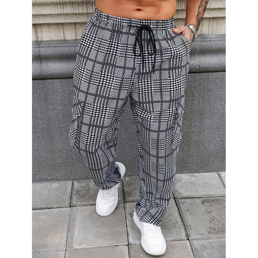 Men’s black and white houndstooth wide straight-leg pants with an elastic drawstring waist and side pockets; lightweight, breathable, loose fit; casual street style for everyday wear, vacations, and home.