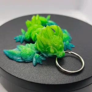 3d printed blue and green rose wyvern keychain