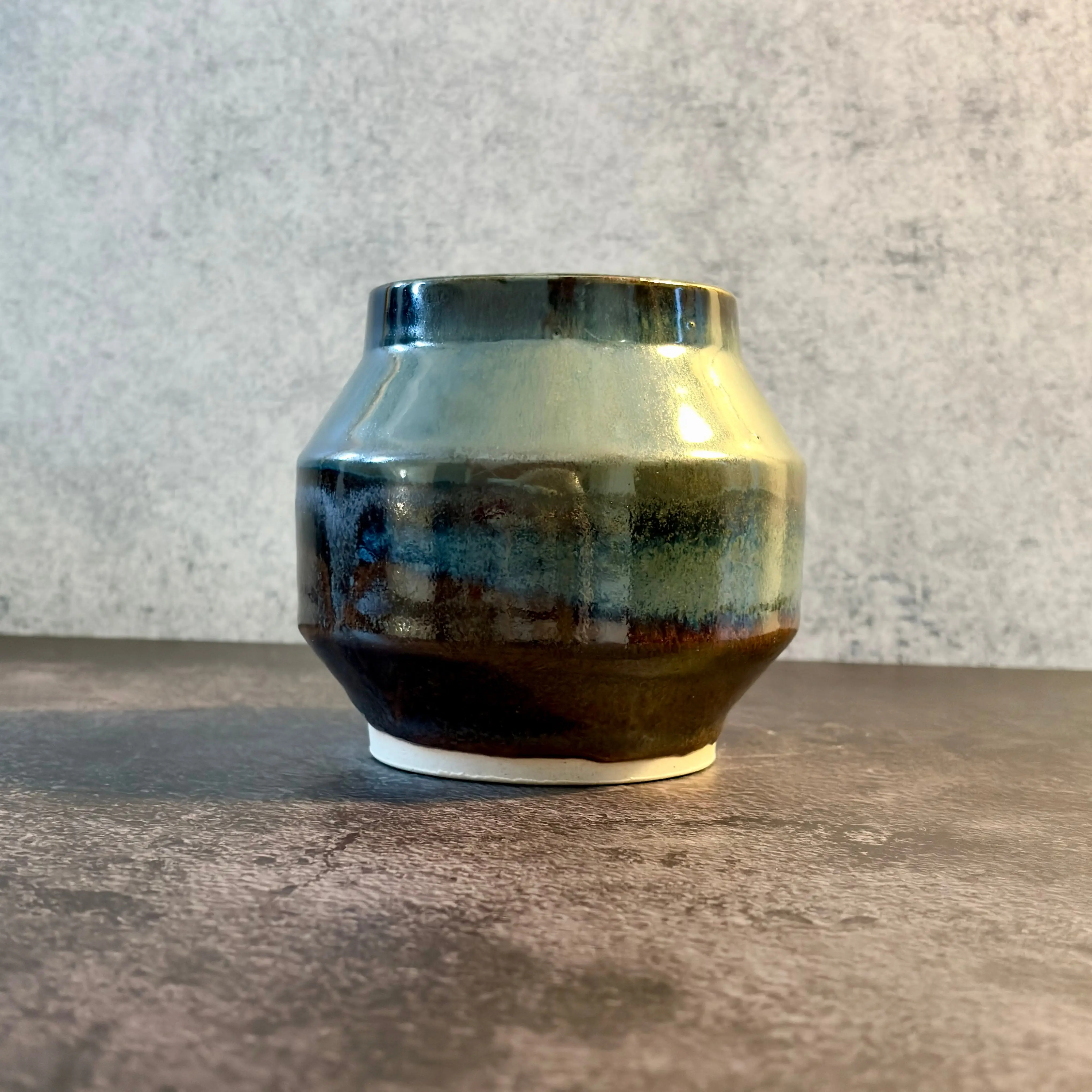 Ember — Faceted Stoneware Vessel in Green-Gold Luster over Charcoal