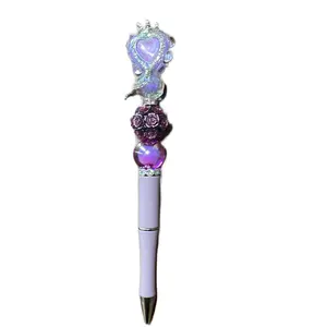 Purple bedazzled pen with Purple Heart charm