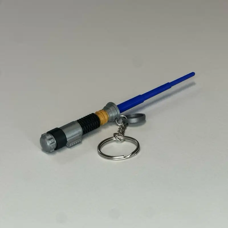 Mini Lightsaber Keychain with Retractable Blade - 3D Printed Plastic Keychain Featuring Blue Blade & Hidden Storage Cap