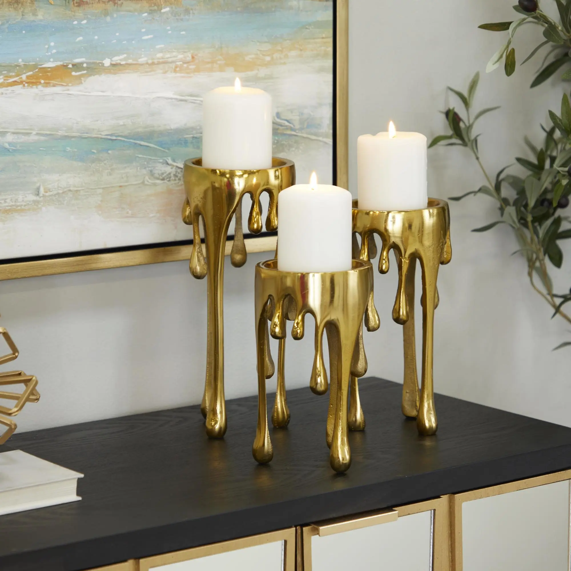 CosmoLiving by Cosmopolitan Set of 3 Abstract Aluminum Metal Melting Drip Decorative Candle Holder with Dripping Melting Designed Legs Set of 3 12", 10", 8"H Romantic