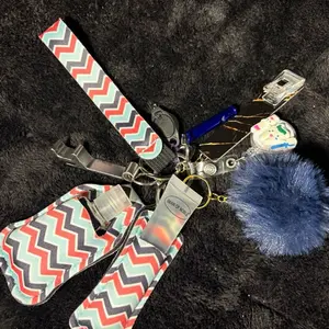 Zig Zag Keychain with Chevron Pattern and Blue Pom Pom Attachment