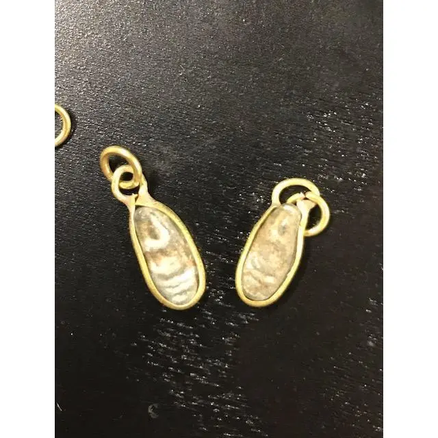 Tiny pear-shaped thai amulet