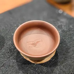 Handmade purple clay teacup