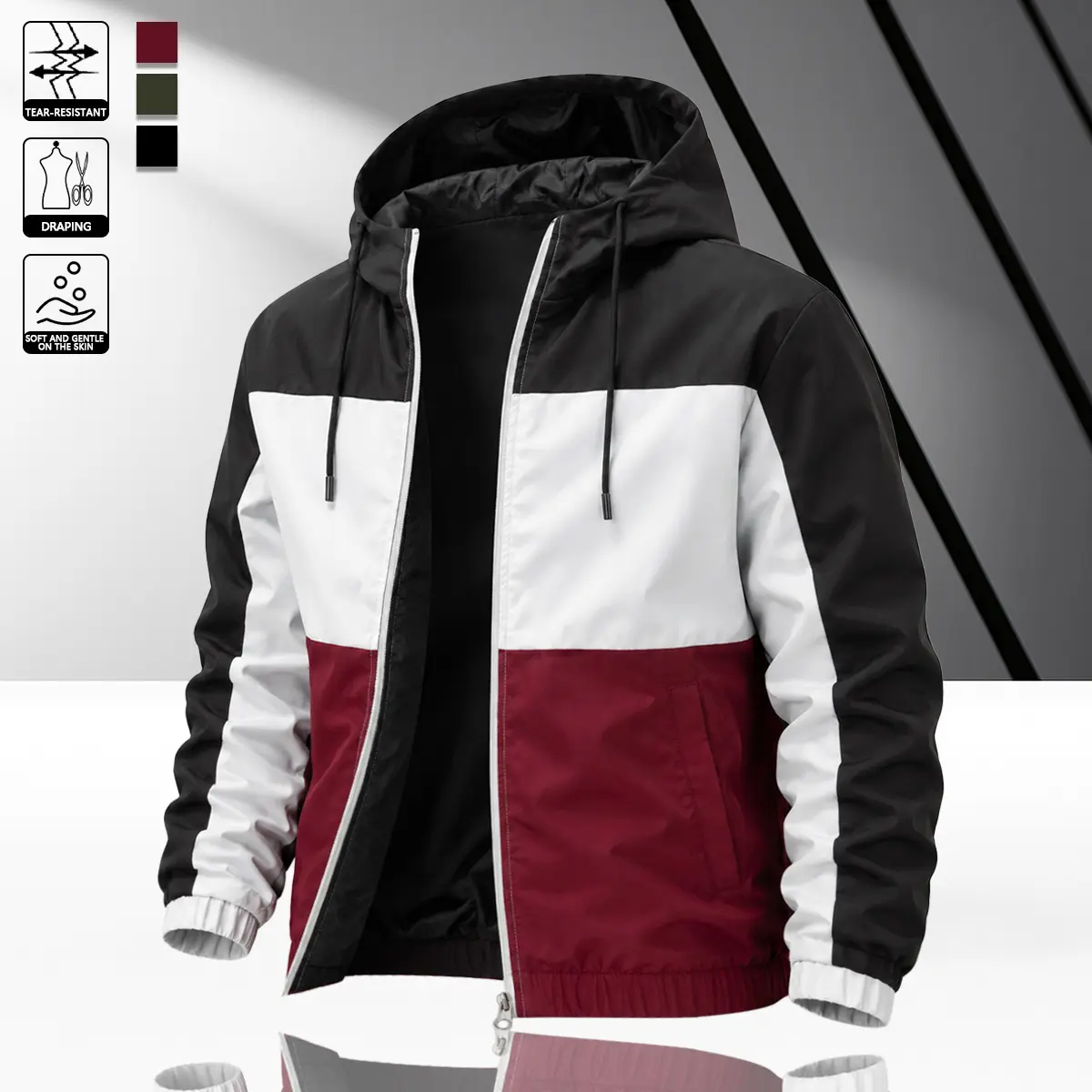 Men’s color-block jacket featuring black, white, and wine red, designed with tear-resistant, skin-friendly fabric. It features a full zip front, ribbed cuffs, and an adjustable drawstring hood, suitable for hiking, commuting, and streetwear styling.