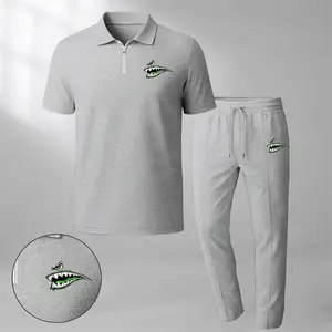 Men's two-piece set features a short-sleeve zip-collar polo shirt and matching trousers. Crafted from breathable, soft-textured waffle-knit fabric, it offers a comfortable, relaxed fit ideal for everyday casual wear.