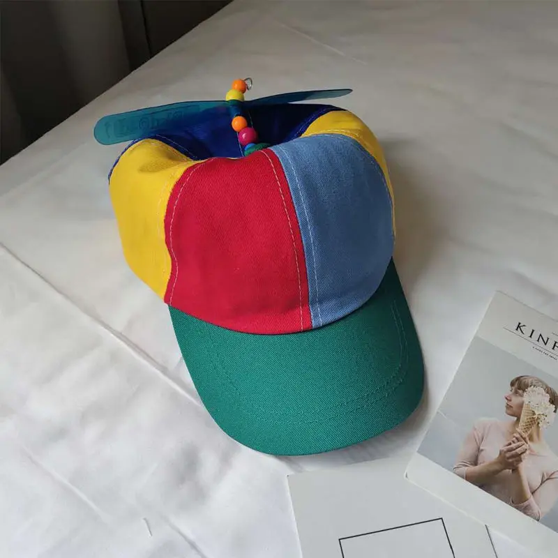 Propeller spinning bamboo hat