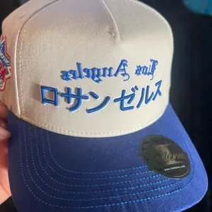 Los Angeles Hats - Classic Design with Curved Brim and "LA" Print, Available in Beige and Blue