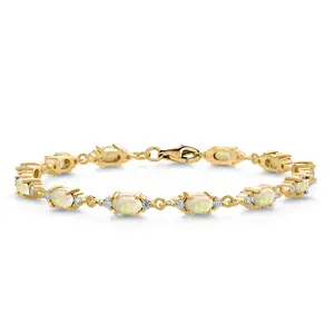 Gem Stone King 18K Yellow Gold Plated Silver White Ethiopian Opal and White Moissanite Tennis Bracelet For Women (4.75 Cttw, Gemstone Birthstone, Oval/Cabochon 6X4MM, 6.5, 7, 7.5 Inch)
