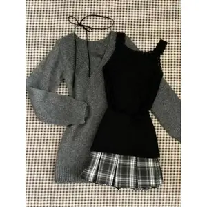 Women’s vintage two-piece set: grey long-sleeve T-shirt and a-line mini pleated plaid skirt; Y2K skirt sets; 2000s clothing; womenswear check