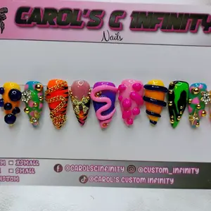 Carol's C Infinity Medium Length Stiletto Nails with Colorful Designs and Unique Patterns