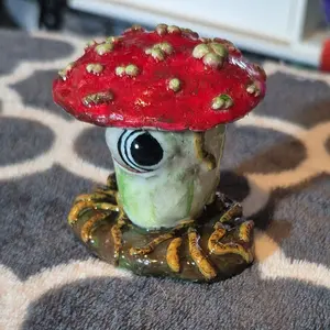 Mushroom horror sculpture. maggots crawling up a rotting mushroom polymer clay sculpture