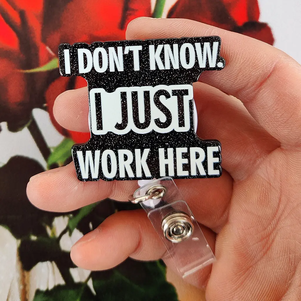 A humorous work card retractable buckle, main body black design with glitter, printed with white text "I DON'T KNOW! I JUST WORK HERE", equipped with retractable structure and transparent clip, Badge Reels, Funny badge reel