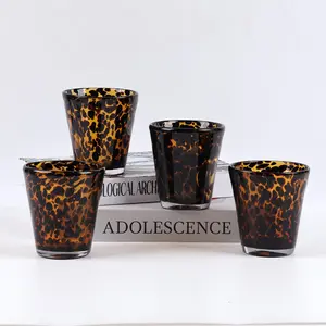 New amber tortoiseshell-colored round household glass cup, transparent and thick, heat-resistant whiskey glass