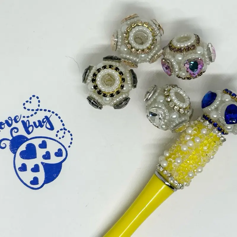 20 mm (5 pieces)rhinestone hearts with pearls mixed bag perfect for crafting pens, cup charms, wristlets, or any other DIY projects.