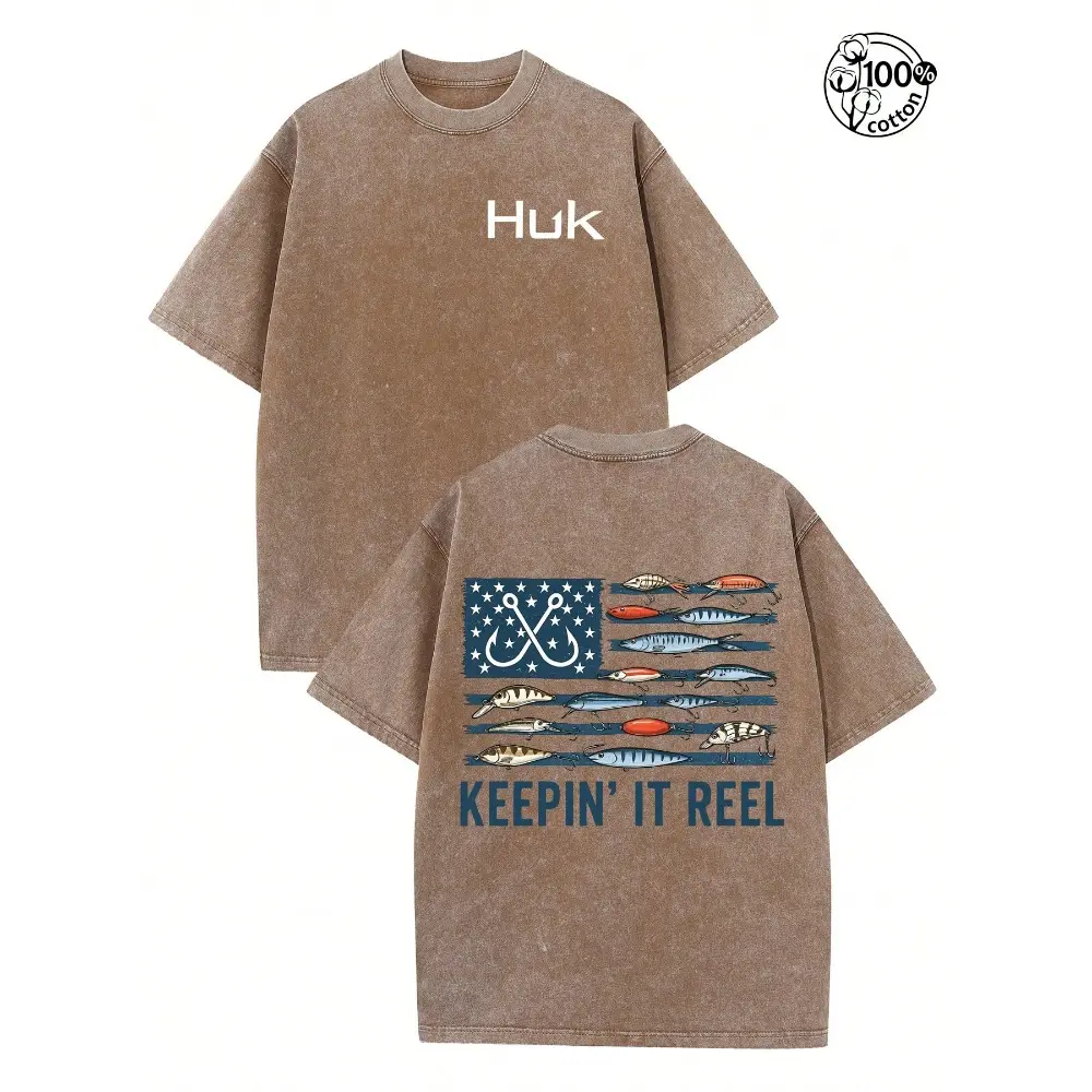 HUK “Keepin’ It Reel” Vintage Washed Fishing T-Shirt – American Flag Bass Lure Graphic Tee for Men, Oversized Outdoor Shirt, Gift for Anglers