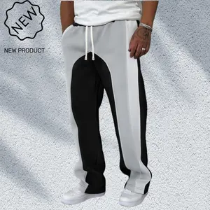 Men's black and white geometric colorblock casual pants feature bold patchwork designeye-catching drawstring waistband loose fit suitable for street fashion trends helping create a unique personal style. Men's long pants with stretch fabric comfy loose fi