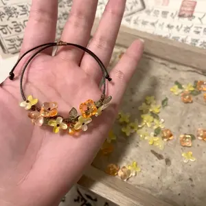 Cottagecore Orange & Yellow Flower Bracelet – Adjustable Cord Bracelet with Leaf Charms