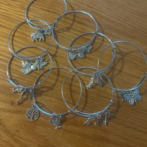 Silver Bangles Set with Random Charms Including Elephant Angel Butterfly Key Tree of Life Designs