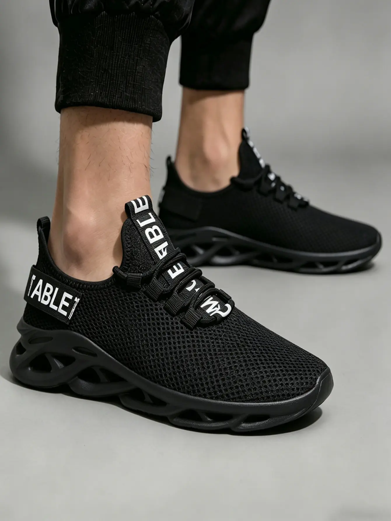 Men's Casual Trainers in All-Black Flyknit, Futuristic Lightweight Design with a Cushioning Hollow Sole for Effortless Daily Walking, Fashion Casual Trainers, Cushioning Casual Trainers