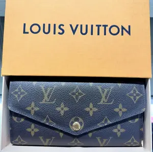 Pre-owned Louis Vuitton Monogram coated canvas with grained cowhide leather lining Bag Accessories Sarah Wallet Monogram Brown Coated Canvas & Grained Leather Lining with Gold Tone Hardware & Press Stud Closure