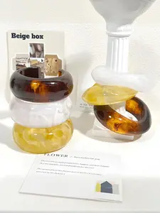 A fashionable, elegant, and simple amber yellow white dyed resin bracelet that can be stacked and worn for daily commuting, holidays, parties, and women's jewelry