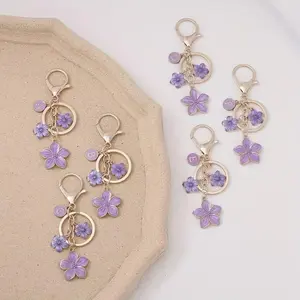 Women's Initial Floral Keychain - Golden-Tone, Purple Floral Motif, Lobster Clasp, Fabric Bead Detail, Elegant Bag Charm, Single Pendant Keyring, Valentine Gift for Fashion Lovers