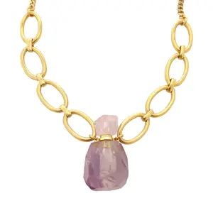 Amethyst gemstone vial pendant on a gold chain necklace