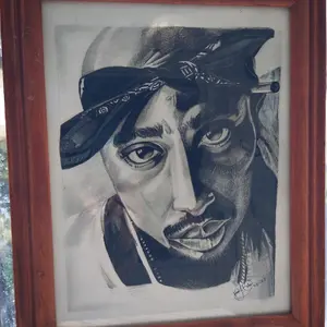 Portrait of the former rapper Tupac Amaru Shakur aka 2pac in a wood frame hand drawn by Artist